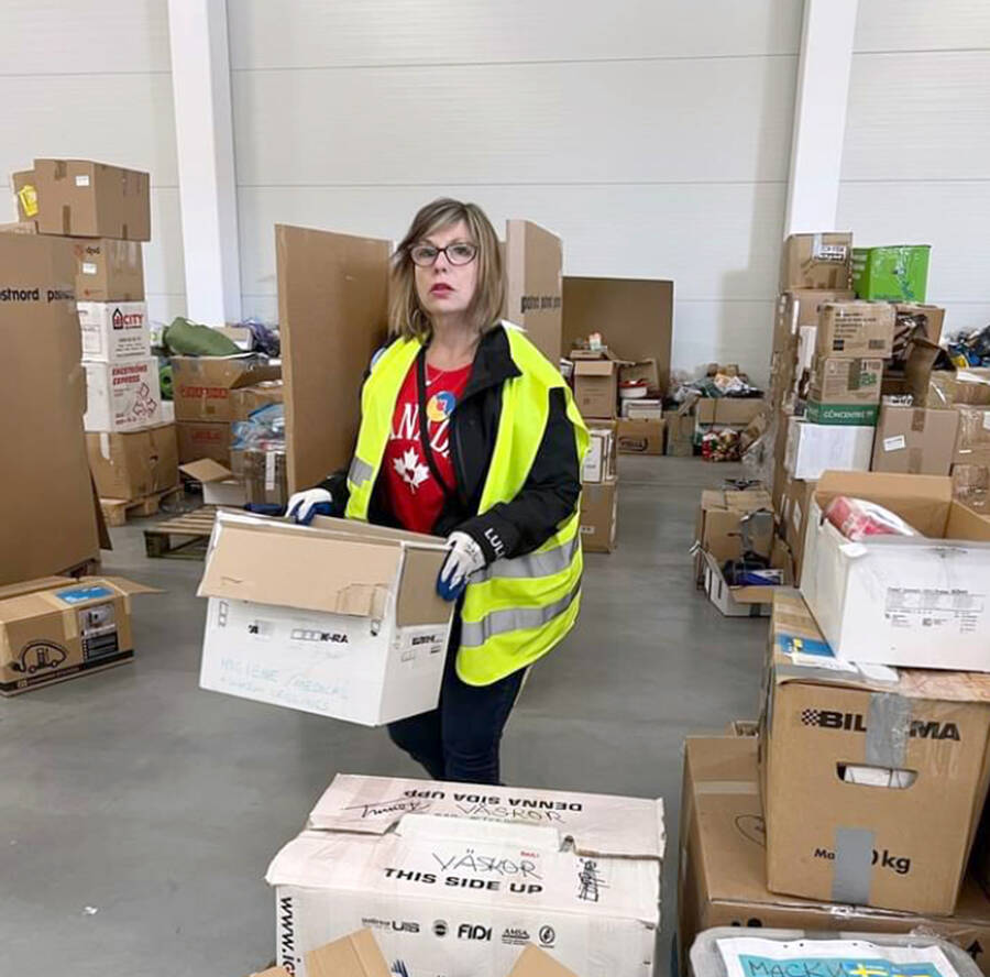 <p>SUBMITTED PHOTO</p><p>Lynn Hennigar of Mahone Bay organizes boxes of donations at a warehouse in Poland.</p>